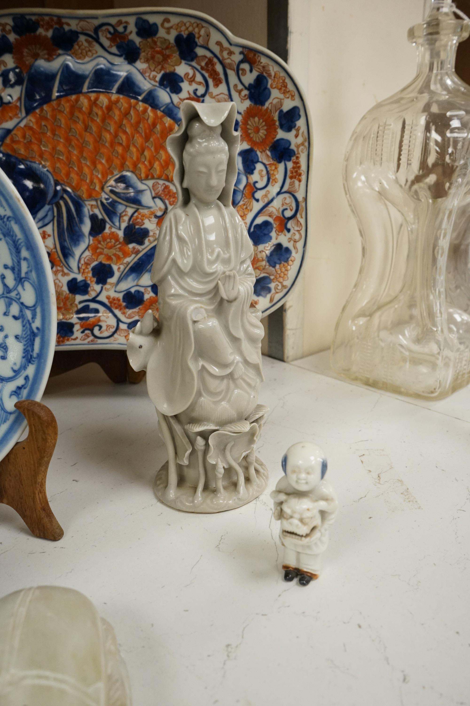 A large collection of various Chinese and Japanese ceramics and collectables to include a 19th century white glazed porcelain figure of Guanyin, largest 30.5cm